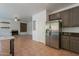 Spacious kitchen next to a fireplace that features stainless steel appliances at 1416 E Sapium Way, Phoenix, AZ 85048