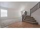 Bright living room with large window and staircase at 1416 E Sapium Way, Phoenix, AZ 85048