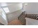 Bright living room features high ceilings, large windows, neutral carpeting, and stairs leading to the main level at 1416 E Sapium Way, Phoenix, AZ 85048