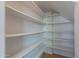 Pantry with shelving providing ample storage space for kitchen items at 1416 E Sapium Way, Phoenix, AZ 85048