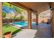 Covered patio featuring a pool view and easy access, perfect for enjoying the outdoors in comfort and style at 1416 E Sapium Way, Phoenix, AZ 85048