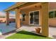 Covered patio with direct access to pool, offering shade and convenience for outdoor gatherings and poolside enjoyment at 1416 E Sapium Way, Phoenix, AZ 85048