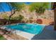 Beautifully landscaped pool with lush greenery and a scenic backdrop, creating a serene oasis for relaxation at 1416 E Sapium Way, Phoenix, AZ 85048