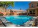 Inviting backyard pool with refreshing turquoise water and lush desert landscaping at 1416 E Sapium Way, Phoenix, AZ 85048