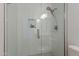 Walk in shower with glass door and mosaic tile flooring at 1416 E Sapium Way, Phoenix, AZ 85048