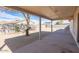 Large covered patio with a mix of gravel and paved areas, great for outdoor entertaining and relaxation at 8464 W Royal Blackheath Dr, Arizona City, AZ 85123