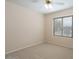 Neutral bedroom with carpet, ceiling fan, and natural lighting at 8464 W Royal Blackheath Dr, Arizona City, AZ 85123