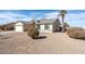 Low angle view of a single story home with xeriscape landscaping and palm tree at 8464 W Royal Blackheath Dr, Arizona City, AZ 85123