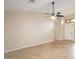 Spacious living room featuring tile flooring, ceiling fan and neutral paint at 8464 W Royal Blackheath Dr, Arizona City, AZ 85123