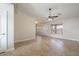 Open concept living room with tile flooring, natural light and neutral color palette at 8464 W Royal Blackheath Dr, Arizona City, AZ 85123