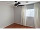 Bedroom with hardwood floors and ceiling fan at 8953 E Yucca St, Scottsdale, AZ 85260