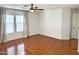 Main bedroom with hardwood floors and neutral walls at 8953 E Yucca St, Scottsdale, AZ 85260