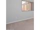 Neutral bedroom with carpet flooring, baseboards, and a window with views of the exterior at 32030 N 20Th Ln, Phoenix, AZ 85085