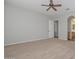 Spacious bedroom with neutral carpet and a ceiling fan at 32030 N 20Th Ln, Phoenix, AZ 85085