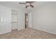 Neutral bedroom with carpet, a closet, and door leading to other rooms at 32030 N 20Th Ln, Phoenix, AZ 85085