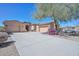 Stunning home featuring a well-manicured landscape, a spacious driveway, and a charming exterior at 32030 N 20Th Ln, Phoenix, AZ 85085