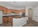 Kitchen with wooden cabinets, granite countertops, and modern appliances at 32030 N 20Th Ln, Phoenix, AZ 85085