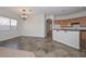 Bright kitchen featuring granite countertops, wooden cabinetry, tile floors, and stainless steel appliances at 32030 N 20Th Ln, Phoenix, AZ 85085