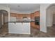 A spacious kitchen featuring wooden cabinets, granite countertops, and modern appliances at 32030 N 20Th Ln, Phoenix, AZ 85085