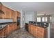 Well-equipped kitchen with stainless steel appliances, granite counters, and tile flooring at 32030 N 20Th Ln, Phoenix, AZ 85085