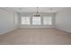 Bright living room with neutral carpet, recessed lighting, and windows with blinds at 32030 N 20Th Ln, Phoenix, AZ 85085