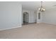 Bright living room with neutral carpet and a modern chandelier at 32030 N 20Th Ln, Phoenix, AZ 85085