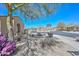 Landscaped front yard with trees surrounding property with circular street view at 32030 N 20Th Ln, Phoenix, AZ 85085