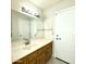 Bathroom with vanity, mirror, and tiled floors at 7119 W Jenan Dr, Peoria, AZ 85345