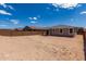 This backyard has ample space for landscaping, a pool, or outdoor activities; featuring a block wall for privacy at 18714 E Panchito Dr, Gold Canyon, AZ 85118