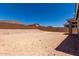 A expansive backyard with block wall, ready for landscaping, a pool, or outdoor living space at 18714 E Panchito Dr, Gold Canyon, AZ 85118