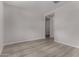 Inviting bedroom featuring wood-look flooring and neutral walls at 18714 E Panchito Dr, Gold Canyon, AZ 85118