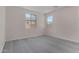 Well-lit bedroom with neutral walls, plush gray carpeting, and bright, natural light at 18714 E Panchito Dr, Gold Canyon, AZ 85118