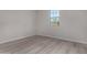 Bright bedroom with hard surface floors, featuring a large window for natural light at 18714 E Panchito Dr, Gold Canyon, AZ 85118