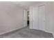 Cozy bedroom with closet, doorway to en suite and plush carpeting at 18714 E Panchito Dr, Gold Canyon, AZ 85118