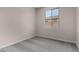 Bright bedroom with a window, carpet, and neutral walls at 18714 E Panchito Dr, Gold Canyon, AZ 85118