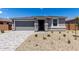 Charming single-story home with a two-car garage and low maintenance desert landscaping at 18714 E Panchito Dr, Gold Canyon, AZ 85118