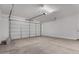 Clean, well-lit garage with a roll-up door and plenty of space for vehicles and storage at 18714 E Panchito Dr, Gold Canyon, AZ 85118