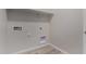 Functional laundry room with connections and space for a washer and dryer, plus overhead shelving at 18714 E Panchito Dr, Gold Canyon, AZ 85118