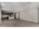 Spacious living room with modern floors, a view to the kitchen and lots of natural light at 18714 E Panchito Dr, Gold Canyon, AZ 85118