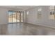 Bright living room with modern flooring and large sliding glass doors to the backyard at 18714 E Panchito Dr, Gold Canyon, AZ 85118
