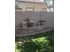 Landscaped backyard with stone water feature and mature trees at 3259 E Isaiah Ct, Gilbert, AZ 85298