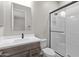 Modern bathroom featuring a glass-enclosed shower and stylish single-sink vanity with sleek hardware at 1021 W Ridge Rd, Apache Junction, AZ 85120