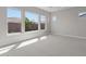 Spacious bedroom with large windows providing ample natural light and views of the neighborhood at 1021 W Ridge Rd, Apache Junction, AZ 85120