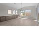 Inviting dining area with recessed lighting, multiple windows, built in cabinets, and tile flooring at 1021 W Ridge Rd, Apache Junction, AZ 85120
