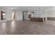 Open-concept kitchen with stainless appliances, granite counters, white cabinets, and a large center island at 1021 W Ridge Rd, Apache Junction, AZ 85120
