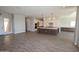 Bright, open kitchen with white cabinets, a large island, and modern pendant lighting at 1021 W Ridge Rd, Apache Junction, AZ 85120