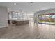 Spacious living area with an open kitchen, tile floors, recessed lighting, and sliding glass doors to the yard at 1021 W Ridge Rd, Apache Junction, AZ 85120