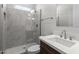 Modern bathroom with a glass-enclosed shower and neutral vanity at 1042 W Ridge Rd, Apache Junction, AZ 85120