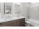 Elegant bathroom featuring double sinks, a white countertop, and a shower-tub combo at 1042 W Ridge Rd, Apache Junction, AZ 85120