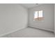 Cozy bedroom with neutral carpet and a window offering natural light at 1042 W Ridge Rd, Apache Junction, AZ 85120